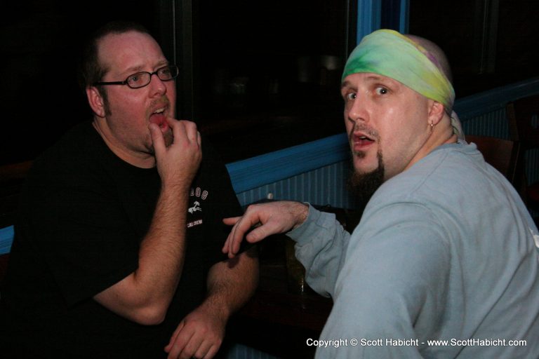 Some sort of goatee/open mouth contest.