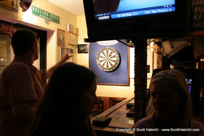 There was a game of darts in the corner....