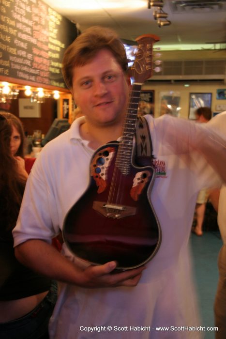It's actually a guitar, he's just 10' 6" tall.