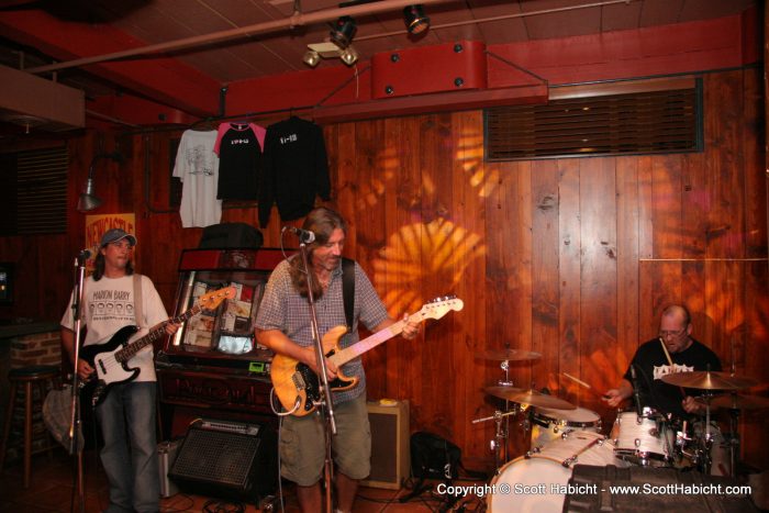 Notice the "merch" hanging behind the band? I want that hoodie.