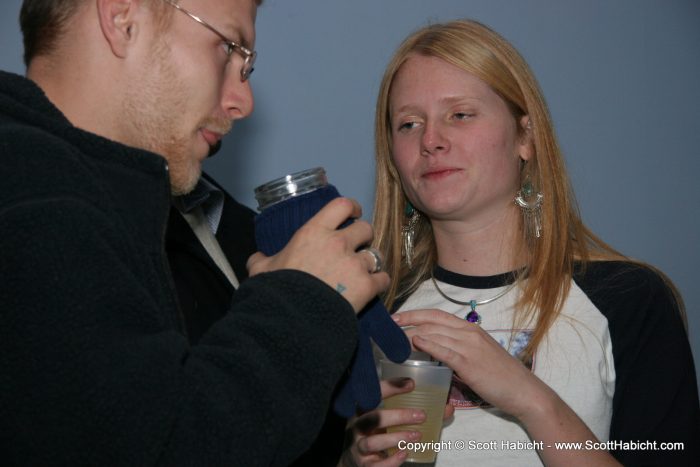 This guy put his glove around his drink.....to keep his hand from getting too cold.