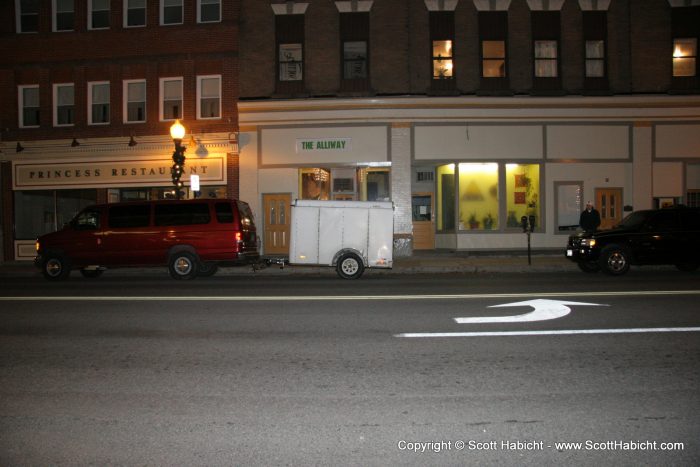 The bar side of Alliway was under the sign, and the band side was in between the vehicles.