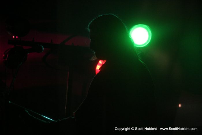 John silhouetted by the stage lighting.