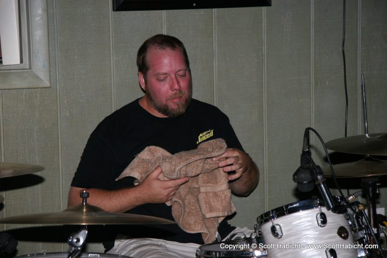 Sonny Martin, drummer playing until he's red in the face.